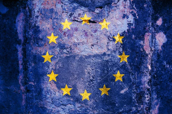 EU flag on wall. European Union flag painted on a grunge cracked wall. Europe, european culture concept