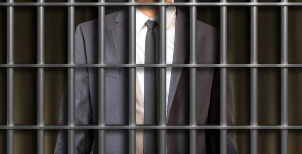 White collar crime, businessman in prison cell concept. Male body part young businessman in gray suit and tie standing behind jail bars. 3d illustration