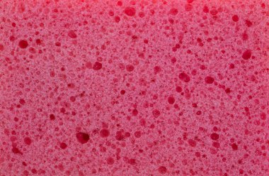 Sünger dokusu arka planı. Pembe renk temizleme sünger malzeme detayı yakın görünüm. Ev işleri ya da güzellik hizmetleri. Makro