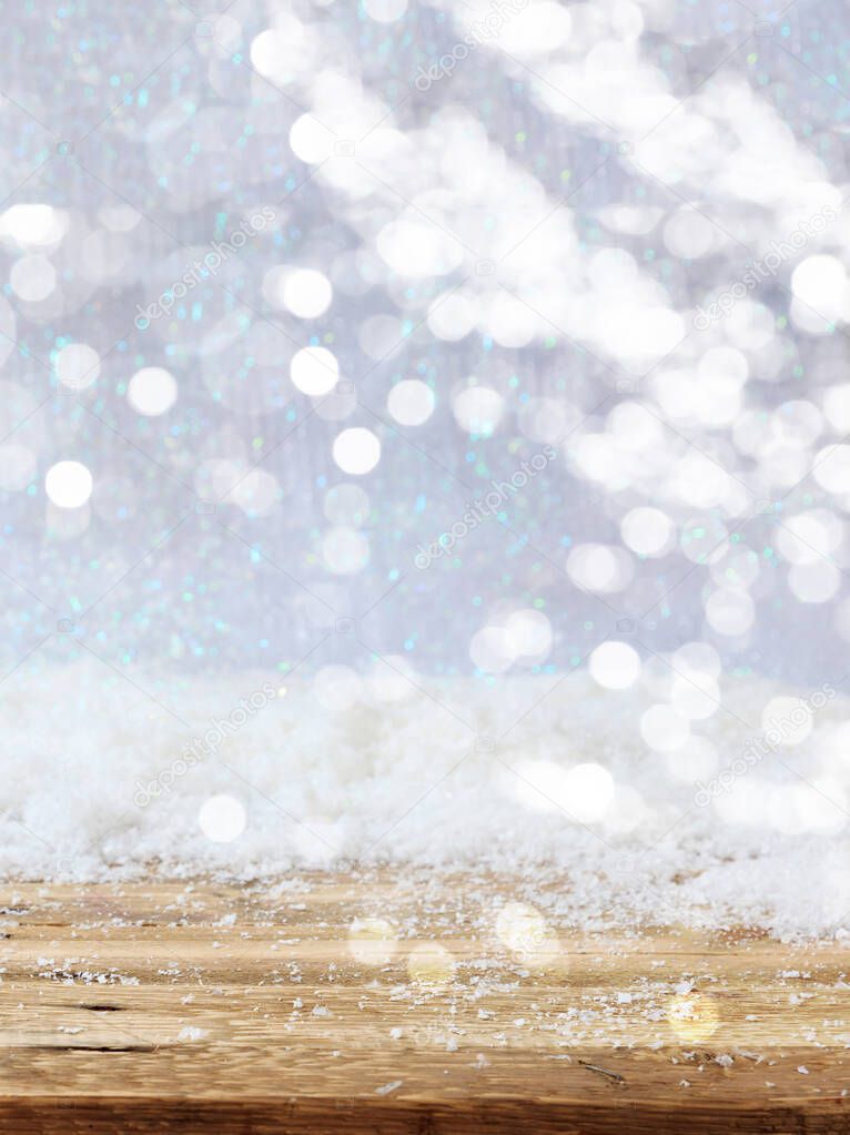 Christmas snowy bokeh background. Snowfall over a wooden table, xmas greeting card mockup, template, vertical, copy space