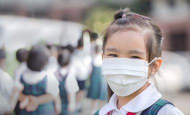Healthcare - girl wearing a protective mask clipart