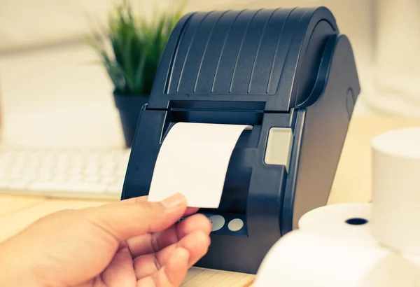 Office equipment, A point of sale receipt printer printing a receipt — Stock Photo, Image