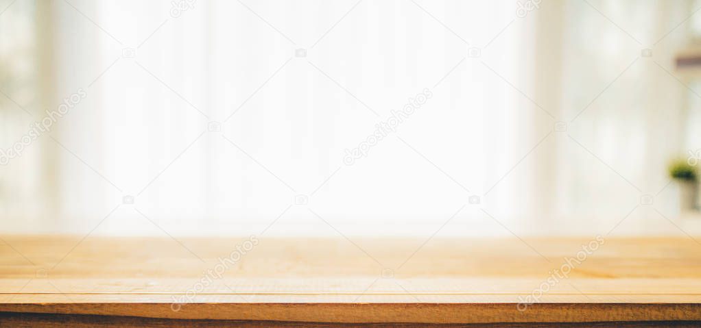 Wood table top on white blurred abstract background 