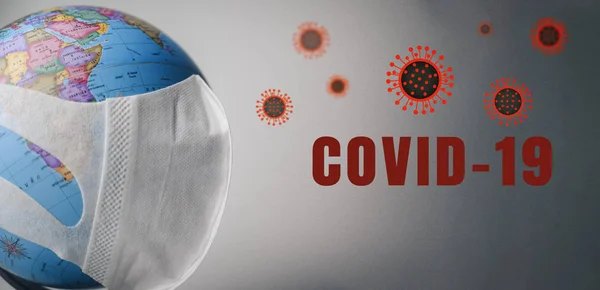 On planet earth, a medical mask to protect against the coronavirus epidemic. Concept of a global virus epidemic. ,. concept of Corona virus quarantine, Covid-19