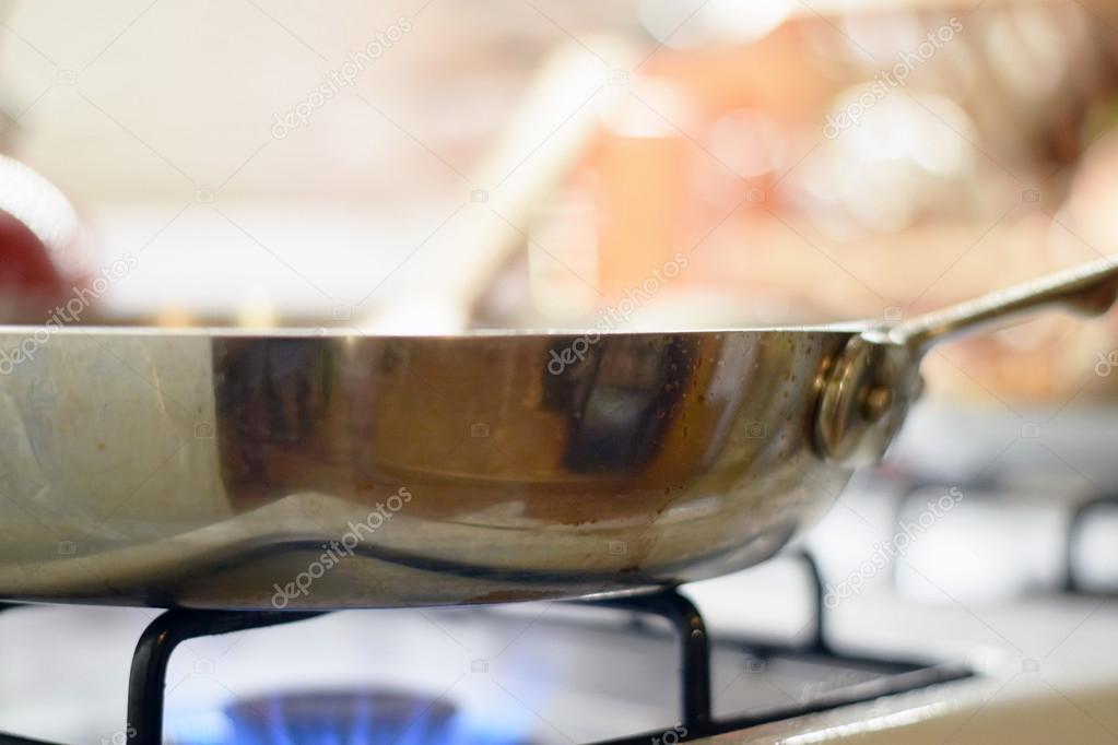 Spatula stirring food in saute pan