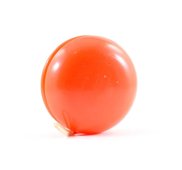 Dize ile parlak neon turuncu plastik yo-yo — Stok fotoğraf
