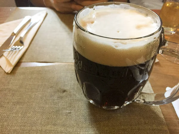Czech dark beer stein on a table