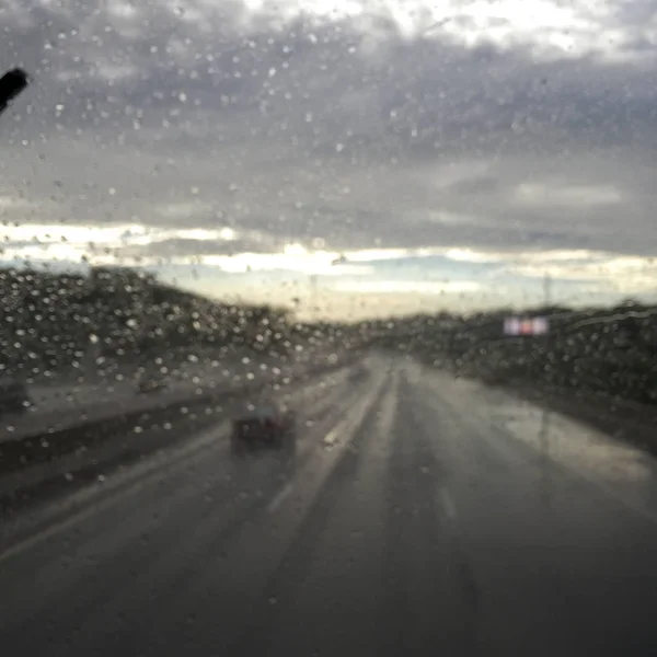 Rain water droplets on a car window — Stock Photo, Image
