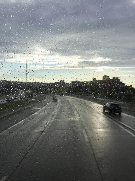 Rain water droplets on a car window — Stock Photo, Image