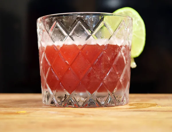 Gourmet cocktail with lime wheel — Stock Photo, Image