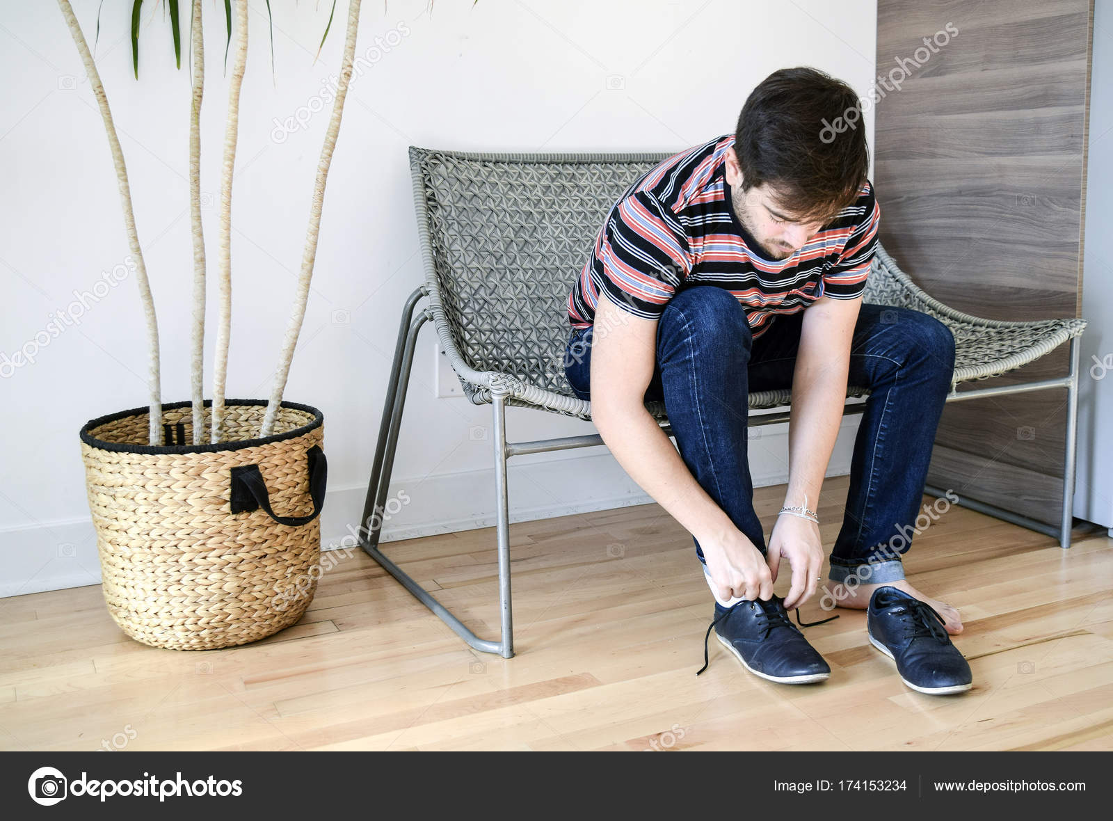 Man putting on his shoes Stock Photo by ©cabecademarmore 174153234