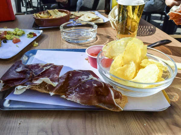 Table at restaurant with Spanish — Stock Photo, Image