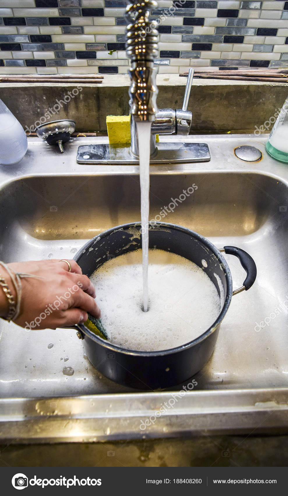 Hand Washing Sauce Pot Sponge Sink Stock Photo by ©cabecademarmore
