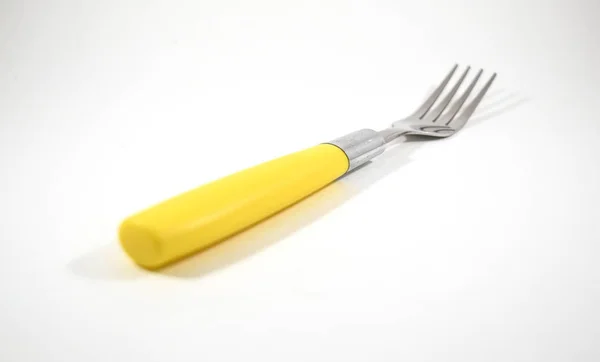 Tenedor Metal Plateado Acero Inoxidable Plástico Amarillo Aislado — Foto de Stock