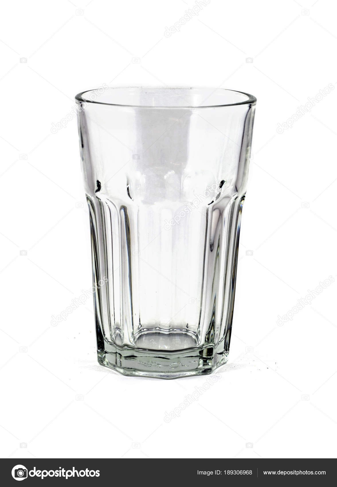 Empty Clear Glass Drinking Cup Ridges Isolated Stock Photo by