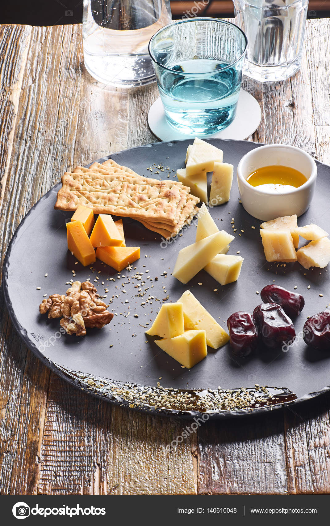 Cheese platter served with crackers — Stock Photo © kovenkin 140610048