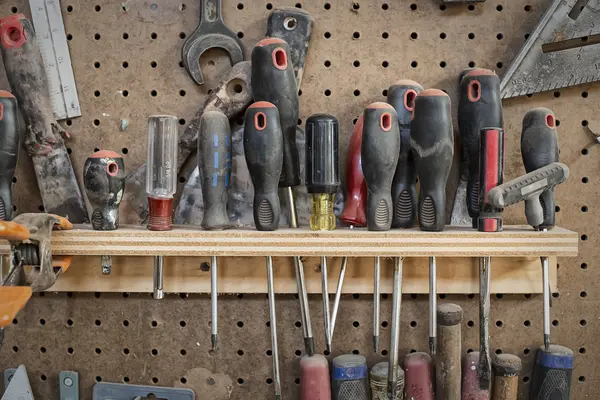 Tool board, with slots for screwdrivers — Stock Photo, Image