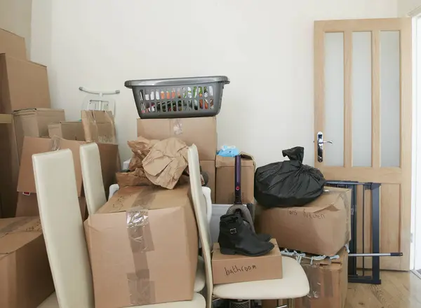 Room filled with cardboard boxes — Stock Photo, Image