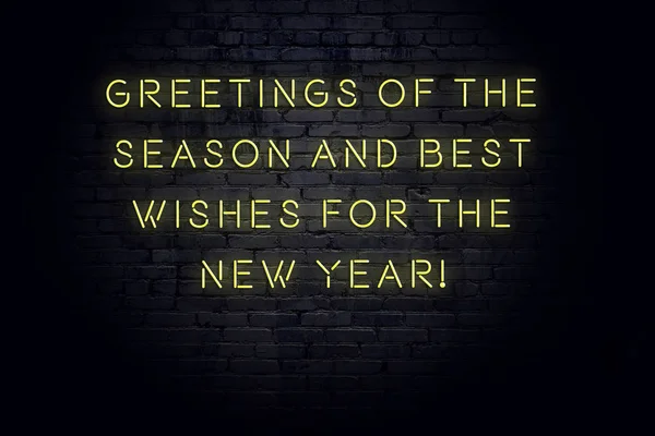 Neon inscription of christmas and new year greetings on brick wall — Stock Photo, Image
