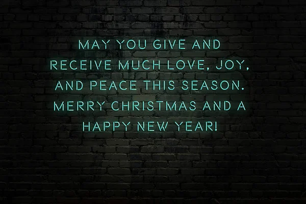 Neon inscription of christmas and new year greetings on brick wall — ストック写真