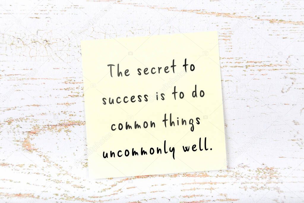 Yellow sticky note with handwritten motivational quote