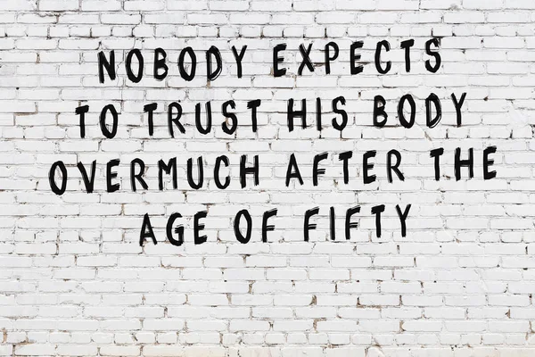 Painted black mindful inscription on white brick wall background — Stock Photo, Image