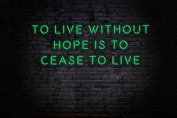 Wise quote. Neon inscription against brick wall — Stock Photo, Image