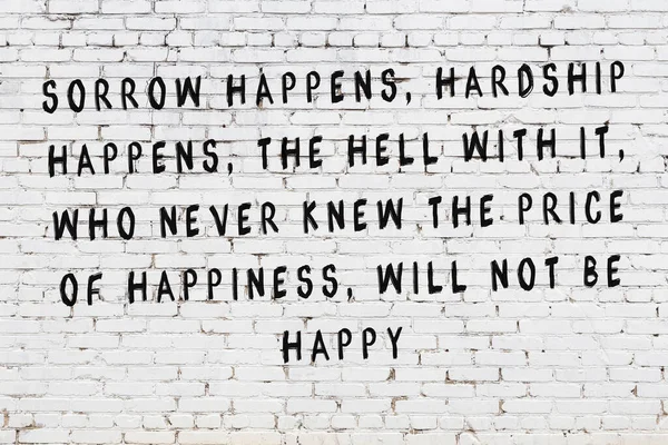 Розфарбований чорний свідомий напис на фоні білої цегляної стіни — стокове фото
