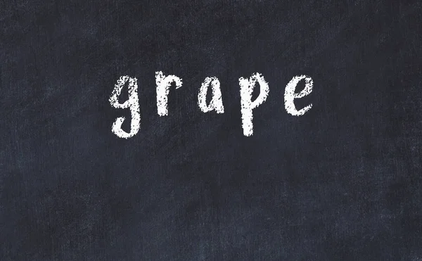 College chalk desk with the word grape written on in — Stock Photo, Image