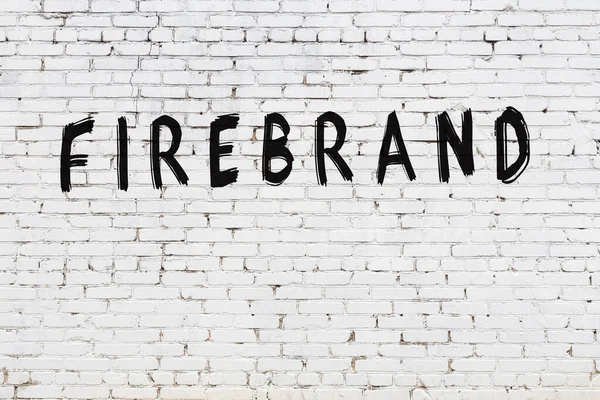 White wall with black paint inscription firebrand on it — Stock Photo, Image
