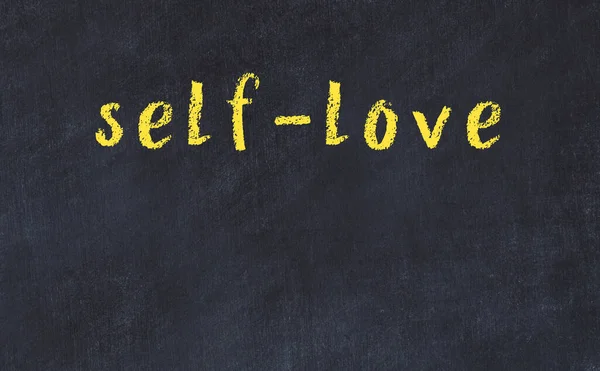 Black chalkboard with inscription self-love on in — Stock Photo, Image