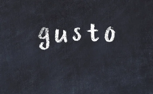 College chalk desk with the word gusto written on in — Stock Photo, Image