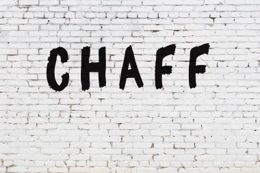 Üzerinde siyah boya deseni olan beyaz duvar.