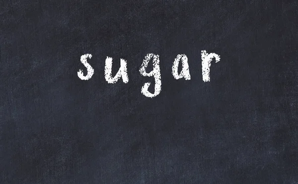 Černá tabule s nápisem cukr v — Stock fotografie