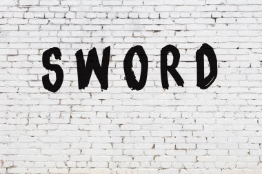 Sözcük kılıcı beyaz tuğla duvara boyanmış.