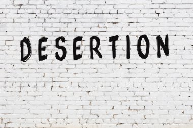 Kelimeler beyaz tuğla duvara yazıldı.