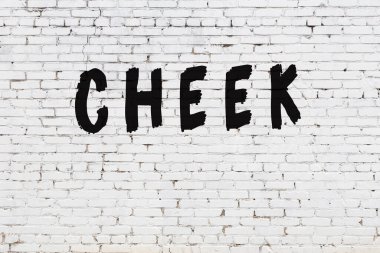 Beyaz tuğla duvara yazılmış kelime yanağı