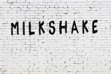 Kelime milkshake beyaz tuğla duvara boyanmış.