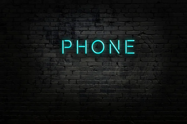 Neon sign with inscription phone against brick wall — Stock Photo, Image