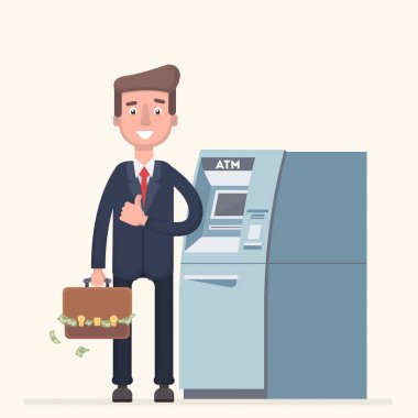 Bir adam bir Atm Standları ve para toplar