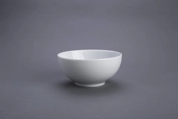 White bowl, gray scene