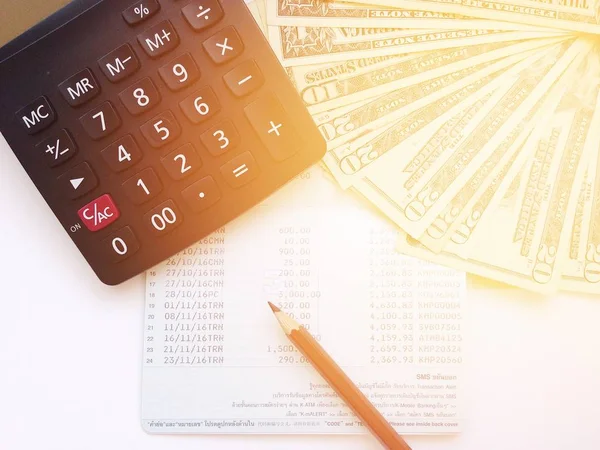 Pencil, calculator, money and savings account passbook or financial statement on white background — Stock Photo, Image