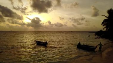 Colourful dusk by the seaside. Journey to Gili Trawangan, Thailand.
