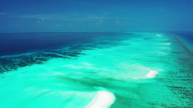 Coastal area with clear shallow water. Enjoying nature of Bali, Indonesia. 