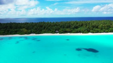 Tropical island in bright turquoise sea. Enjoying nature of Bali, Indonesia. 