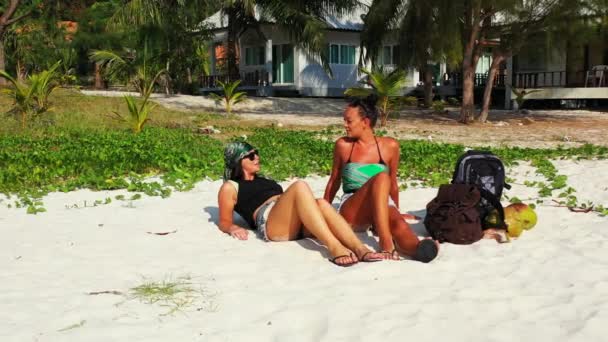 Two Young Girl Friends Sitting Sandy Sea Coast Baggages Next — Stock Video