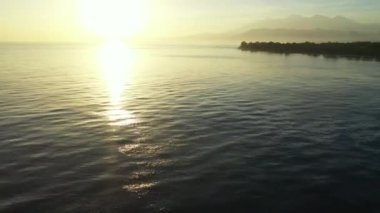 Sunset by the seaside. Tropical nature of Bali, Indonesia. 