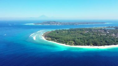 Seascape from aerial point of view during sunny weather. Tropical nature of Bali, Indonesia.