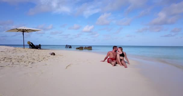 Couple Swimsuits Enjoying Time Sitting Beach Maldives — Stock Video