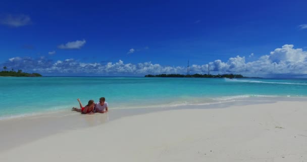 Young Man Woman Lay Sea Coast Sunbathing Beautiful Couple Resting — Stock Video
